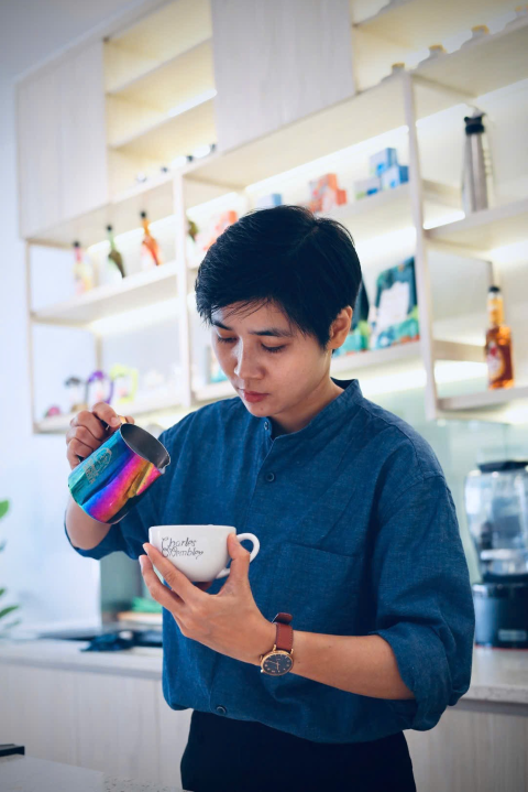 Barista mixing cocktail